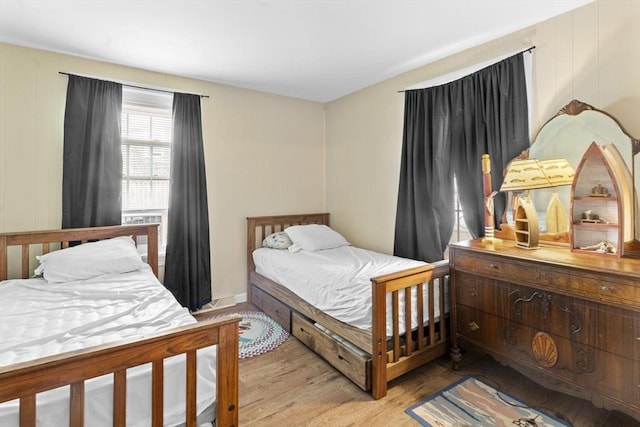 bedroom featuring wood finished floors