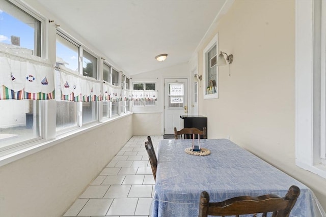 sunroom featuring vaulted ceiling