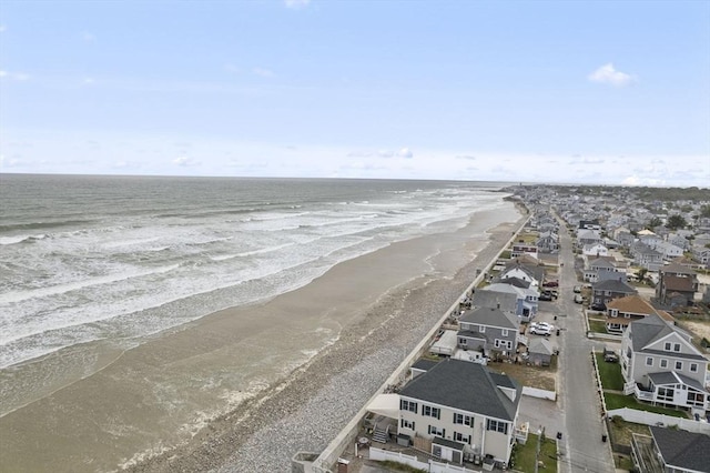 view of water feature with a view of the beach and a residential view