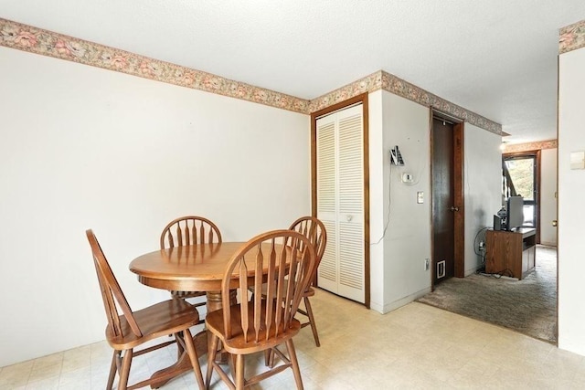 116 Corey Colonial Unit 116, Agawam, MA 01001 - dining area with light flooring and a textured ceiling