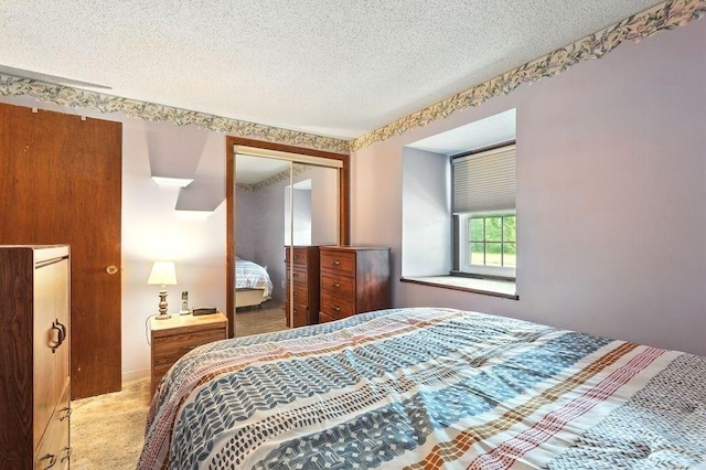 116 Corey Colonial Unit 116, Agawam, MA 01001 - bedroom with a closet, a textured ceiling, and carpet floors