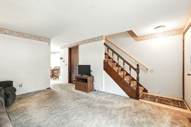 116 Corey Colonial Unit 116, Agawam, MA 01001 - unfurnished living room with stairs and carpet