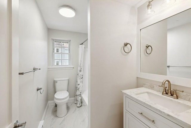 bathroom featuring marble finish floor, toilet, shower / bath combo, vanity, and baseboards