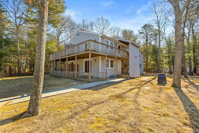 back of house featuring a deck