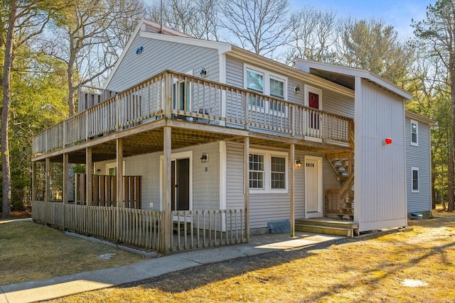 view of front of home featuring a deck and stairway