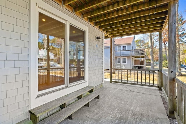 view of patio featuring a balcony