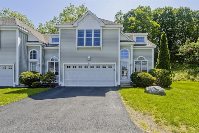 61 Providence Rd Unit 4, Grafton, MA 01519 - view of front facade featuring asphalt driveway, an attached garage, and a front lawn