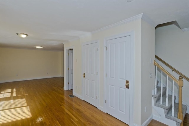 61 Providence Rd Unit 4, Grafton, MA 01519 - hallway featuring crown molding, wood finished floors, baseboards, and stairway