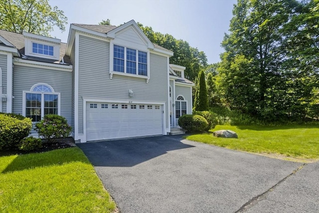 61 Providence Rd Unit 4, Grafton, MA 01519 - view of front of home with a garage, asphalt driveway, a front yard, and roof with shingles