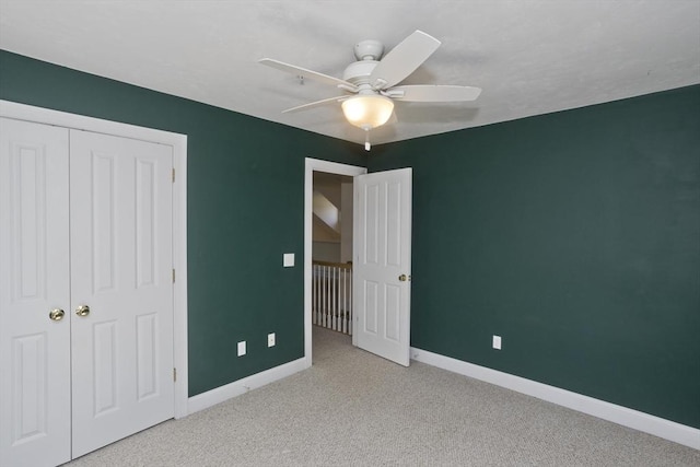 61 Providence Rd Unit 4, Grafton, MA 01519 - unfurnished bedroom with baseboards, carpet flooring, a ceiling fan, and a closet