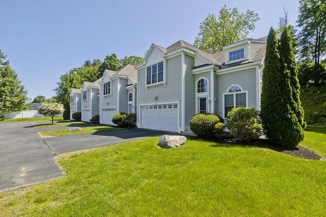 61 Providence Rd Unit 4, Grafton, MA 01519 - view of front facade featuring an attached garage, asphalt driveway, and a front yard