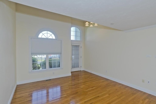 61 Providence Rd Unit 4, Grafton, MA 01519 - unfurnished room featuring a chandelier, wood finished floors, and baseboards