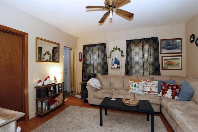 living room with ceiling fan and hardwood / wood-style flooring