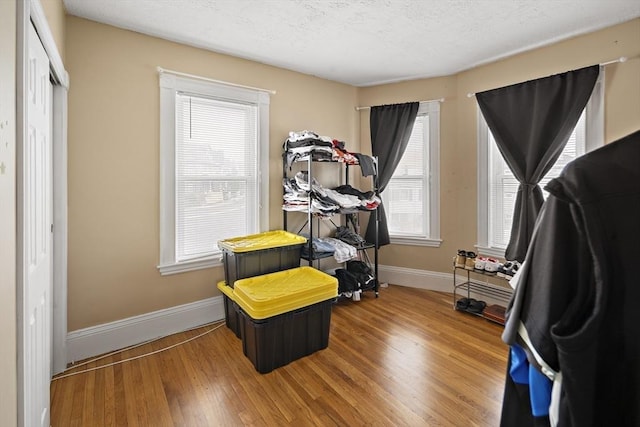 1 Elwood St, Everett, MA 02149 - home office with wood finished floors and a textured ceiling