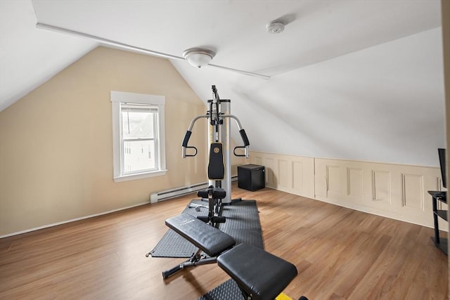 1 Elwood St, Everett, MA 02149 - workout area with wood finished floors, vaulted ceiling, and a baseboard heating unit