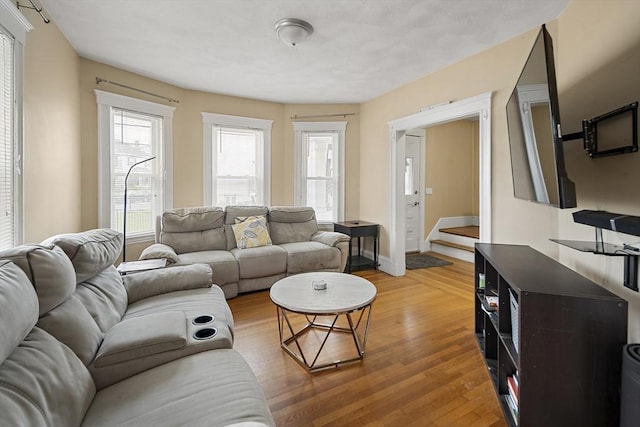 1 Elwood St, Everett, MA 02149 - living area featuring light wood finished floors and stairway