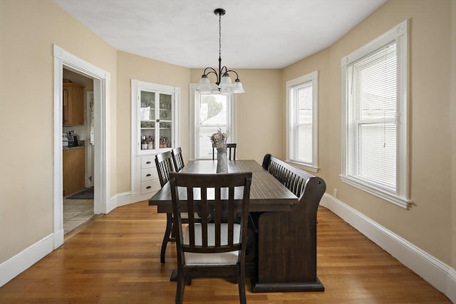 1 Elwood St, Everett, MA 02149 - dining room with a chandelier and light wood-style flooring