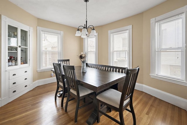 1 Elwood St, Everett, MA 02149 - dining room with wood finished floors and a chandelier
