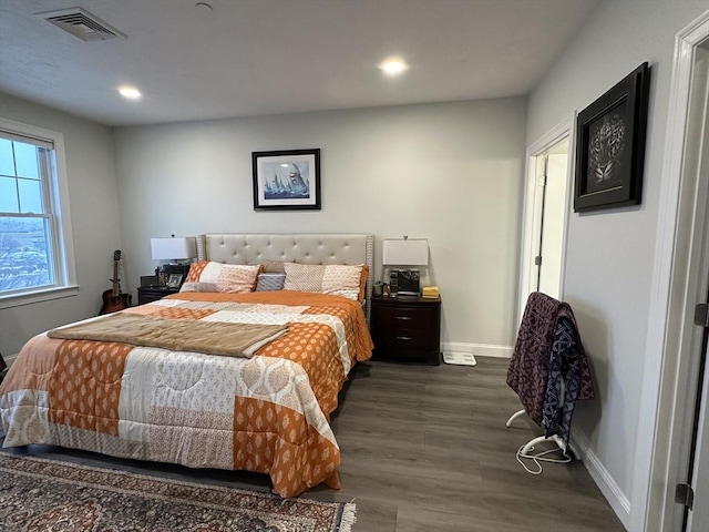 bedroom featuring dark hardwood / wood-style floors