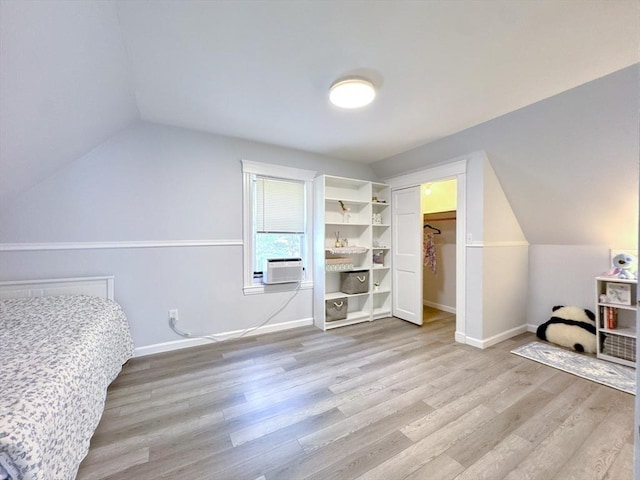 121 N Main St, Natick, MA 01760 - unfurnished bedroom with lofted ceiling, cooling unit, and light wood-type flooring