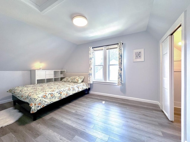 121 N Main St, Natick, MA 01760 - bedroom with lofted ceiling and wood finished floors