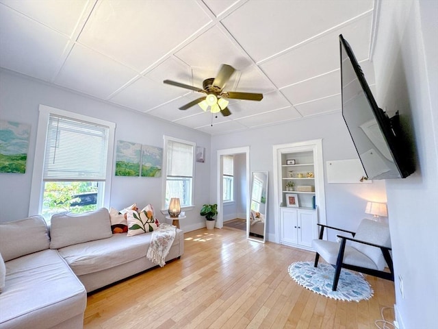 121 N Main St, Natick, MA 01760 - living room with built in features, light wood-style flooring, and ceiling fan
