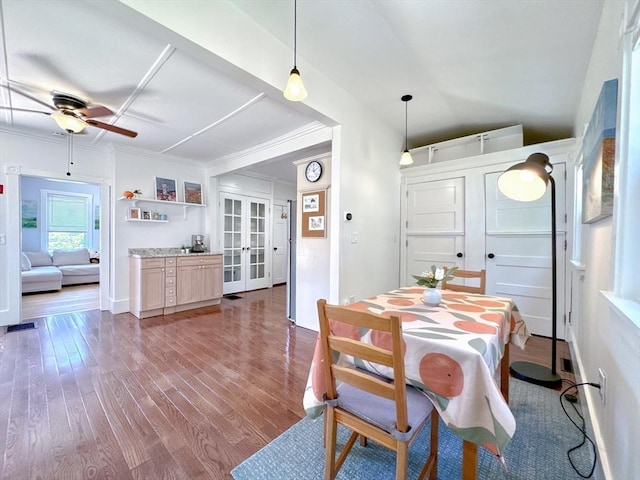 121 N Main St, Natick, MA 01760 - dining space featuring french doors, ceiling fan, dark wood-style flooring, and ornamental molding