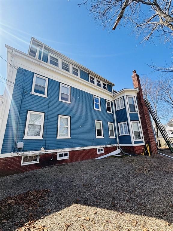 view of property exterior featuring a chimney