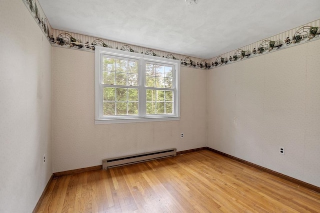 66 Park St, Pepperell, MA 01463 - spare room with baseboard heating and light wood-style flooring
