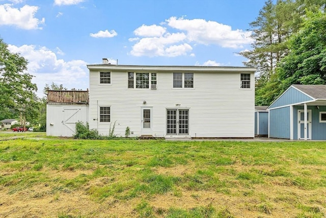 66 Park St, Pepperell, MA 01463 - rear view of house with a lawn and a storage unit