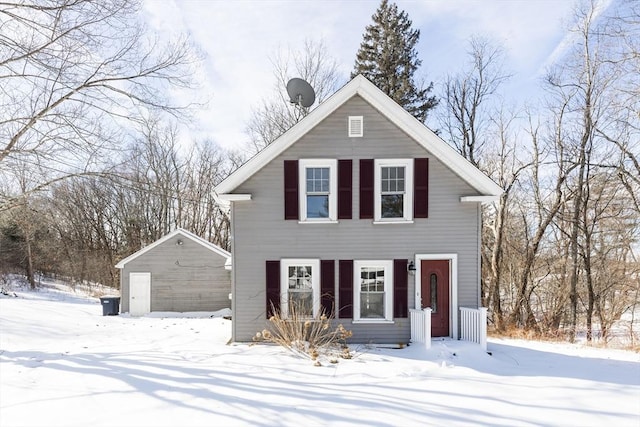 view of front of house featuring a garage and an outdoor structure