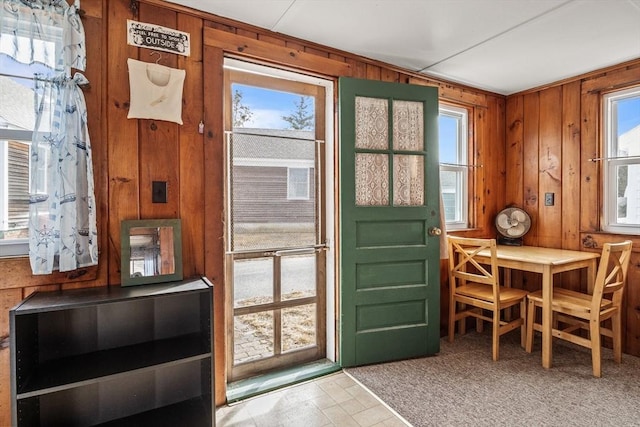 entryway with wooden walls