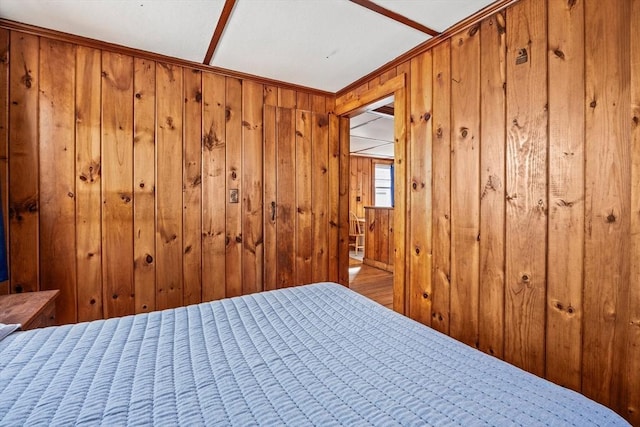 unfurnished bedroom with wood walls