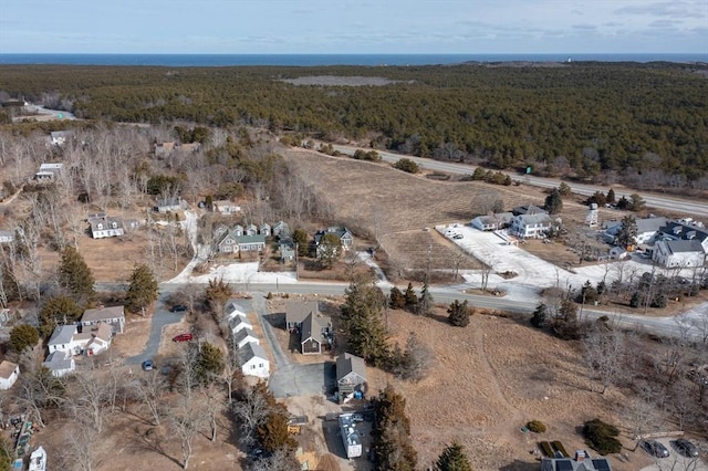 drone / aerial view featuring a forest view