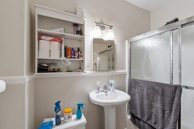 bathroom with a shower stall