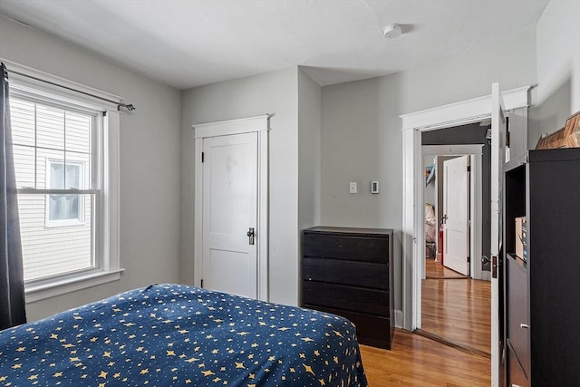 bedroom with wood finished floors