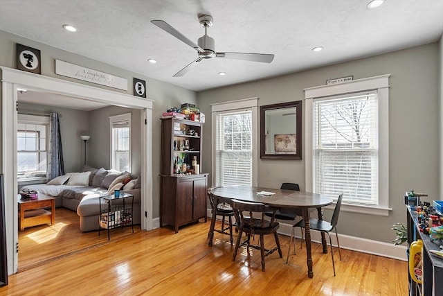 dining room featuring a healthy amount of sunlight and light wood-style flooring