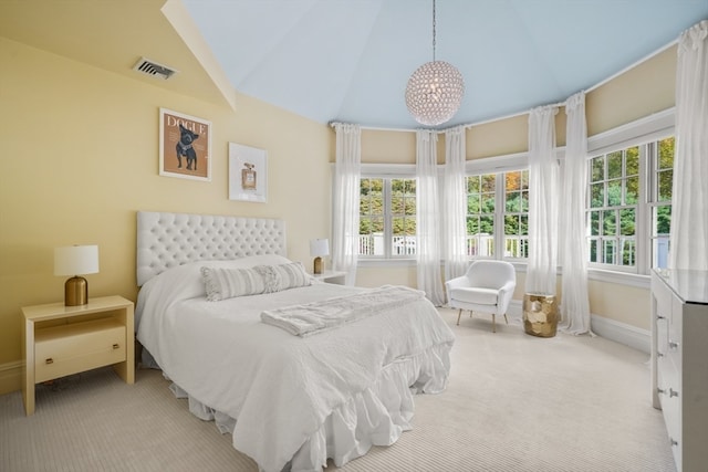 carpeted bedroom featuring lofted ceiling