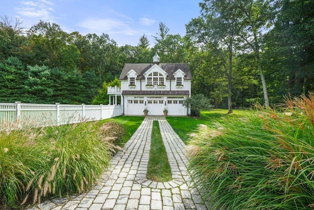 back of property featuring a yard and a garage