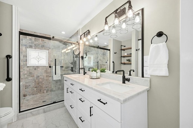 bathroom featuring a sink, toilet, and a shower stall