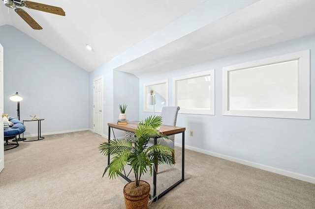 office with baseboards, lofted ceiling, light colored carpet, and a ceiling fan