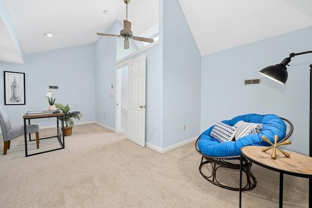 living area featuring visible vents, light carpet, lofted ceiling, and a ceiling fan