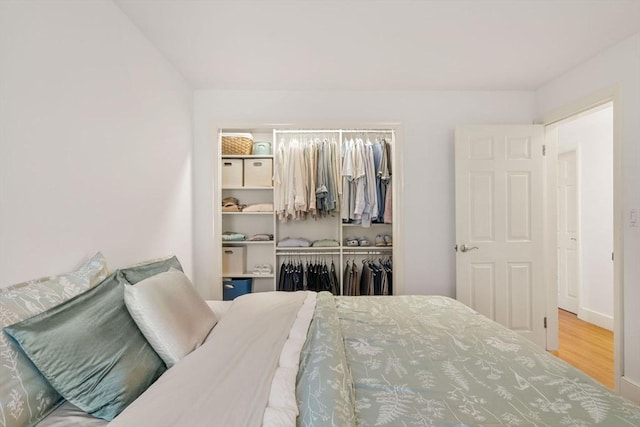 bedroom featuring a closet and wood finished floors