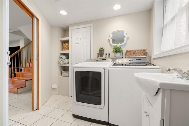 clothes washing area with built in shelves, separate washer and dryer, light tile patterned floors, and recessed lighting
