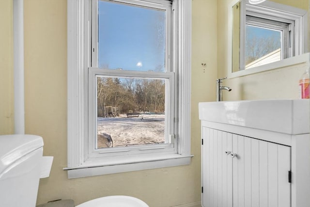 bathroom with vanity and toilet