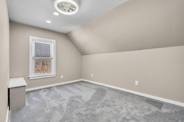 additional living space featuring lofted ceiling, carpet, baseboards, and recessed lighting