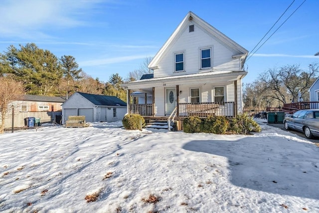 view of front of property with a garage, covered porch, an outdoor structure, and fence