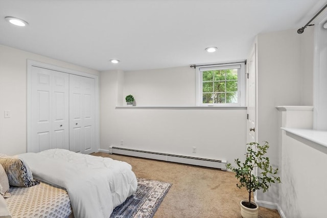carpeted bedroom featuring recessed lighting, baseboards, a baseboard heating unit, and a closet