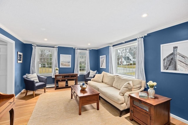 living room with light wood finished floors, recessed lighting, crown molding, and baseboards