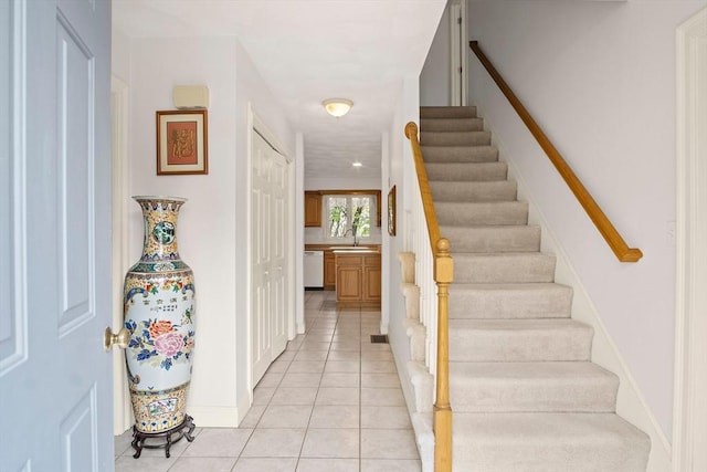 stairs with tile patterned flooring and baseboards